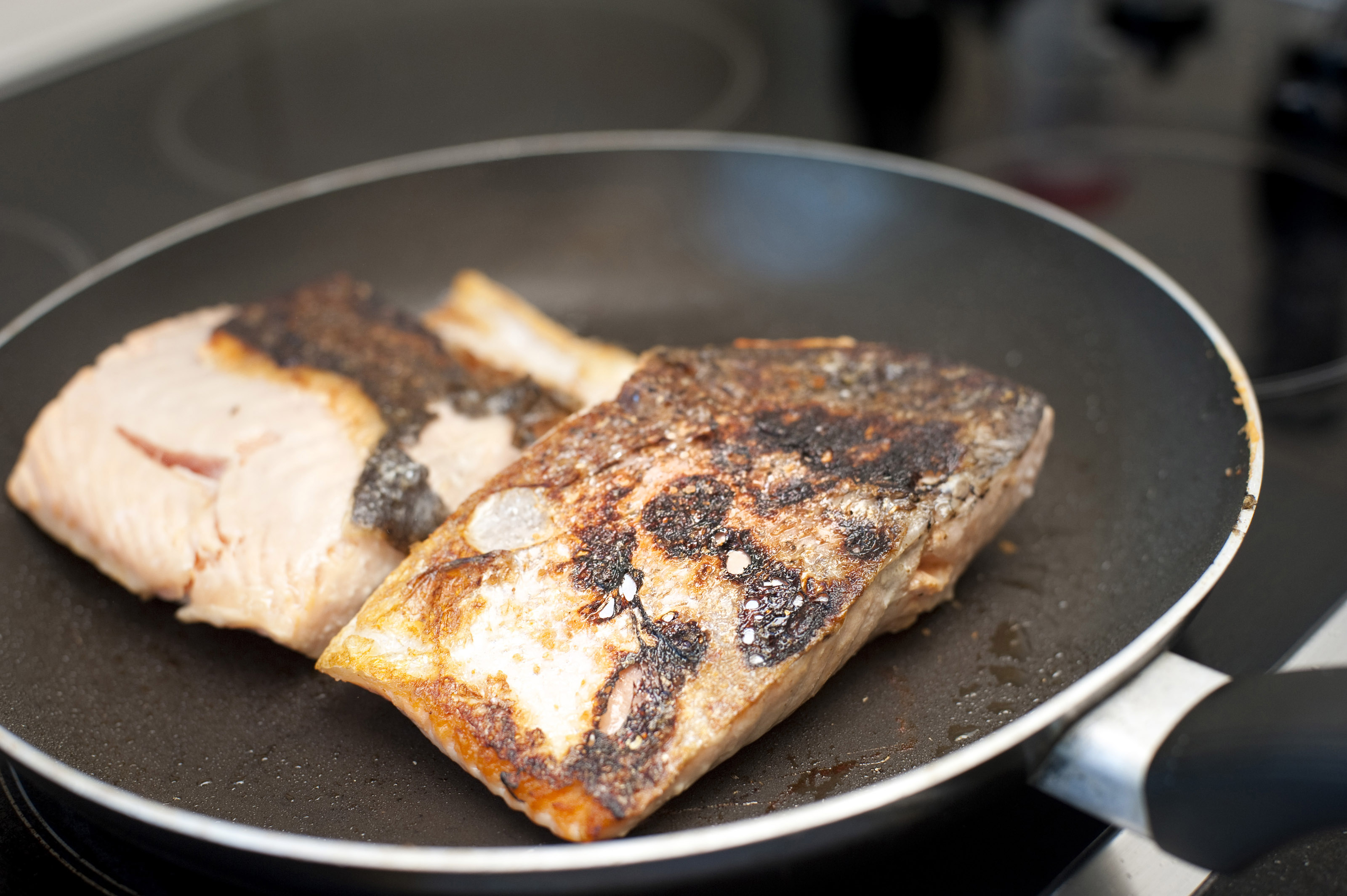 Searing fresh fish in a frying pan8019 Stockarch Free Stock Photos