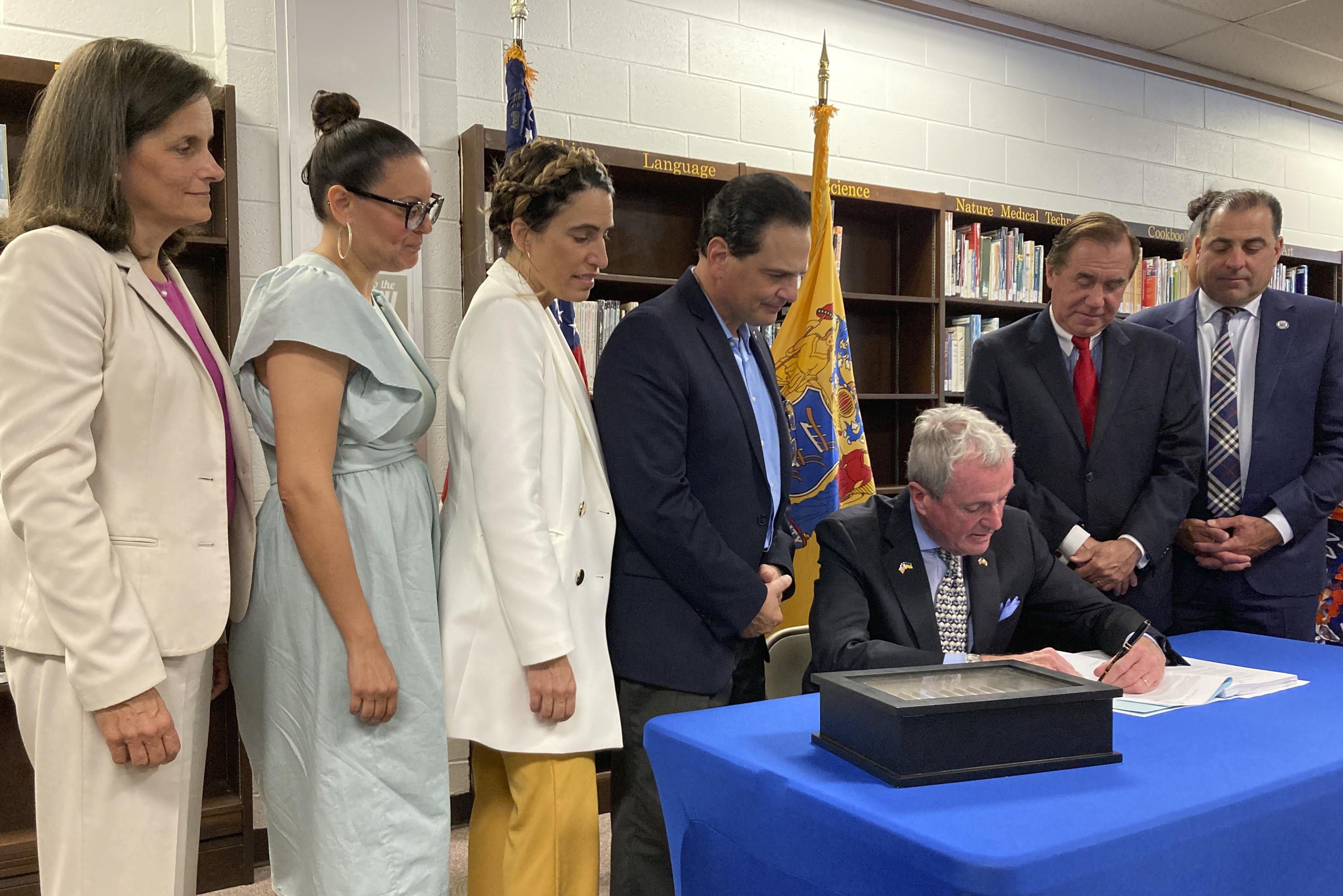 Murphy signs 50.6 billion budget with property tax relief AP News