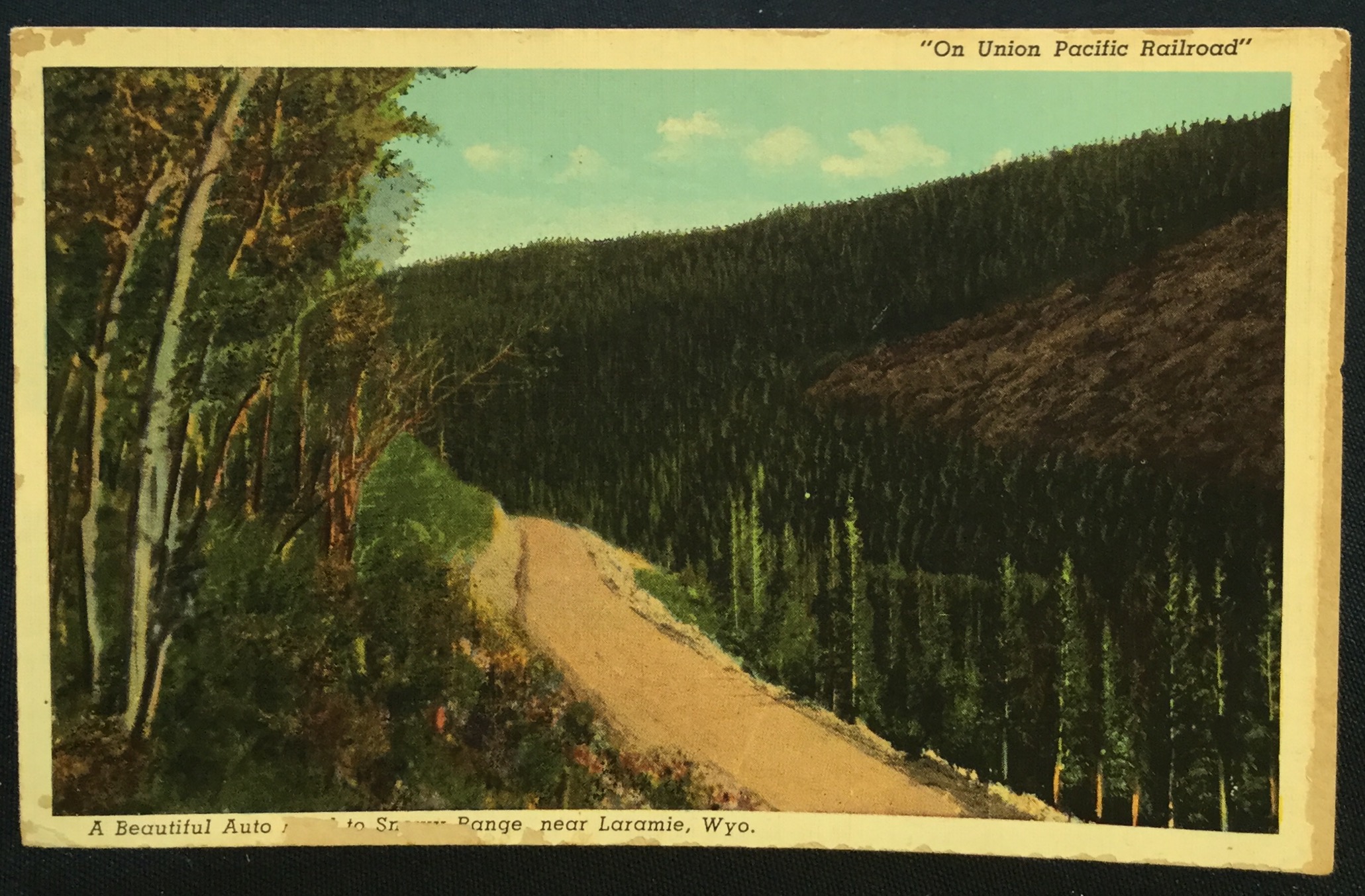 Postcard Unused “On Union Pacific Railroad” Medicine Bows Laramie WY LB