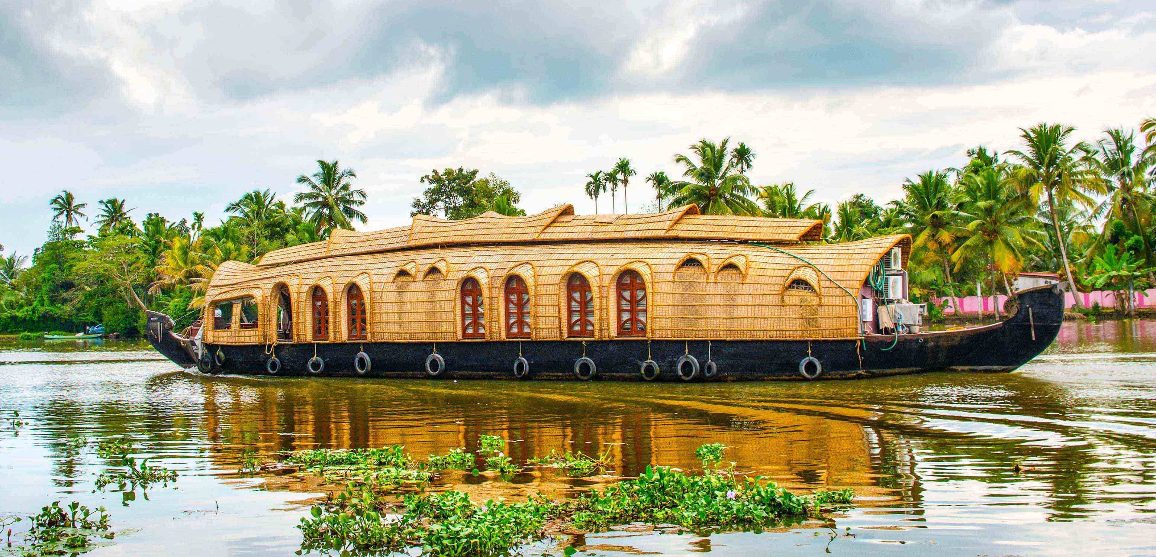 Enjoy a tranquil houseboat cruise in the Kerala backwaters Prune