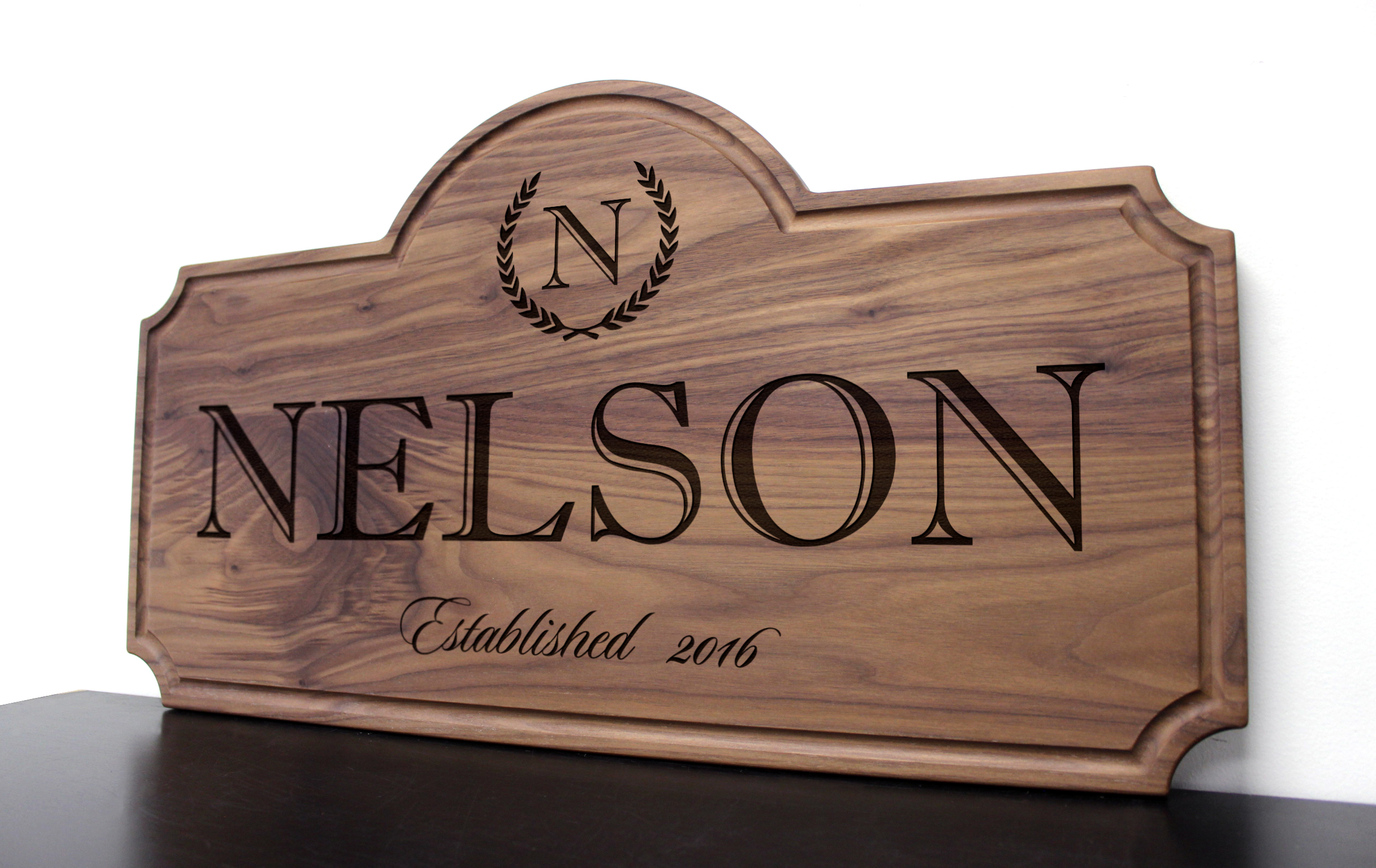 Family Name with Laurels and Initial Design 3 Walnut Sign Straga