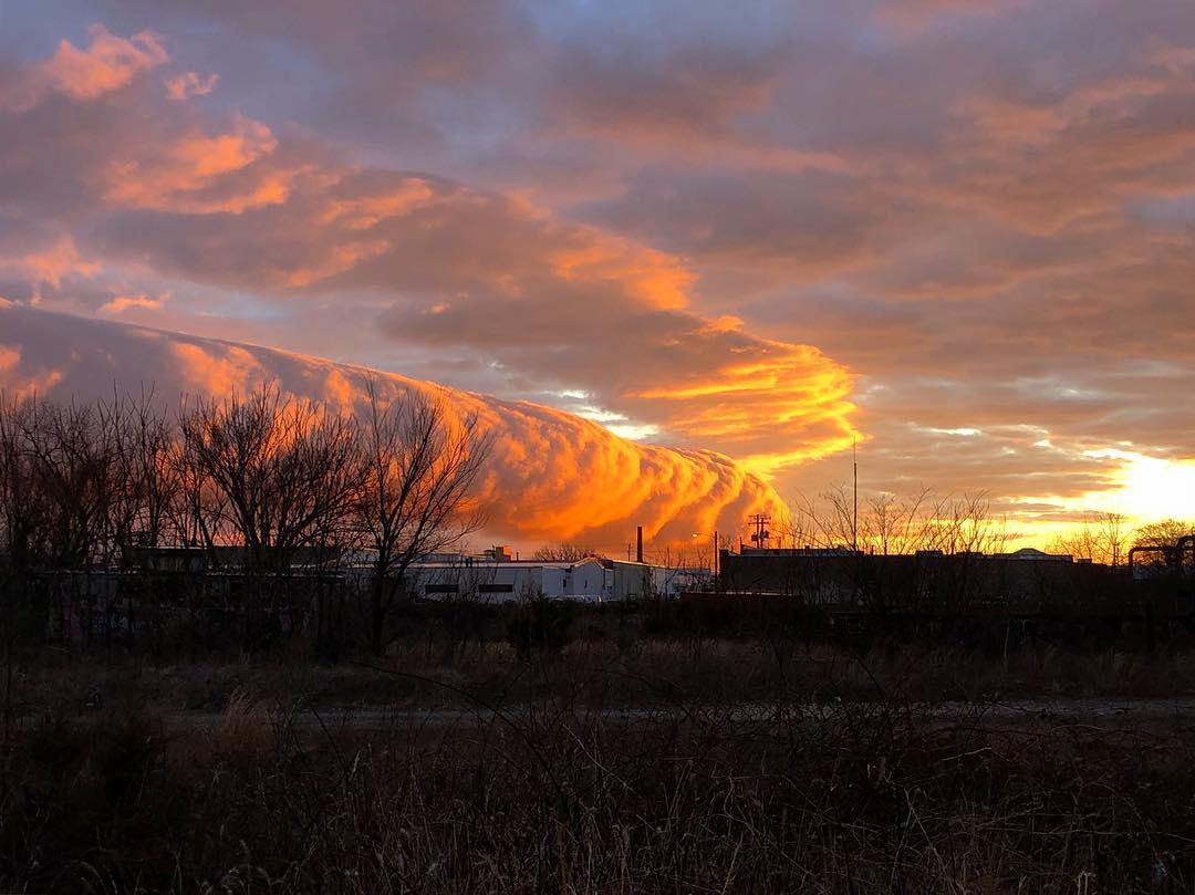 Fiery roll cloud engulfs Virginia's sky at sunrise in pictures