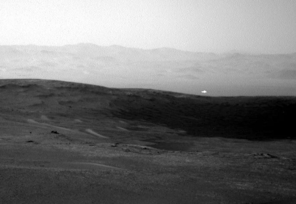A weird glowing light and a new crater have been discovered on Mars in