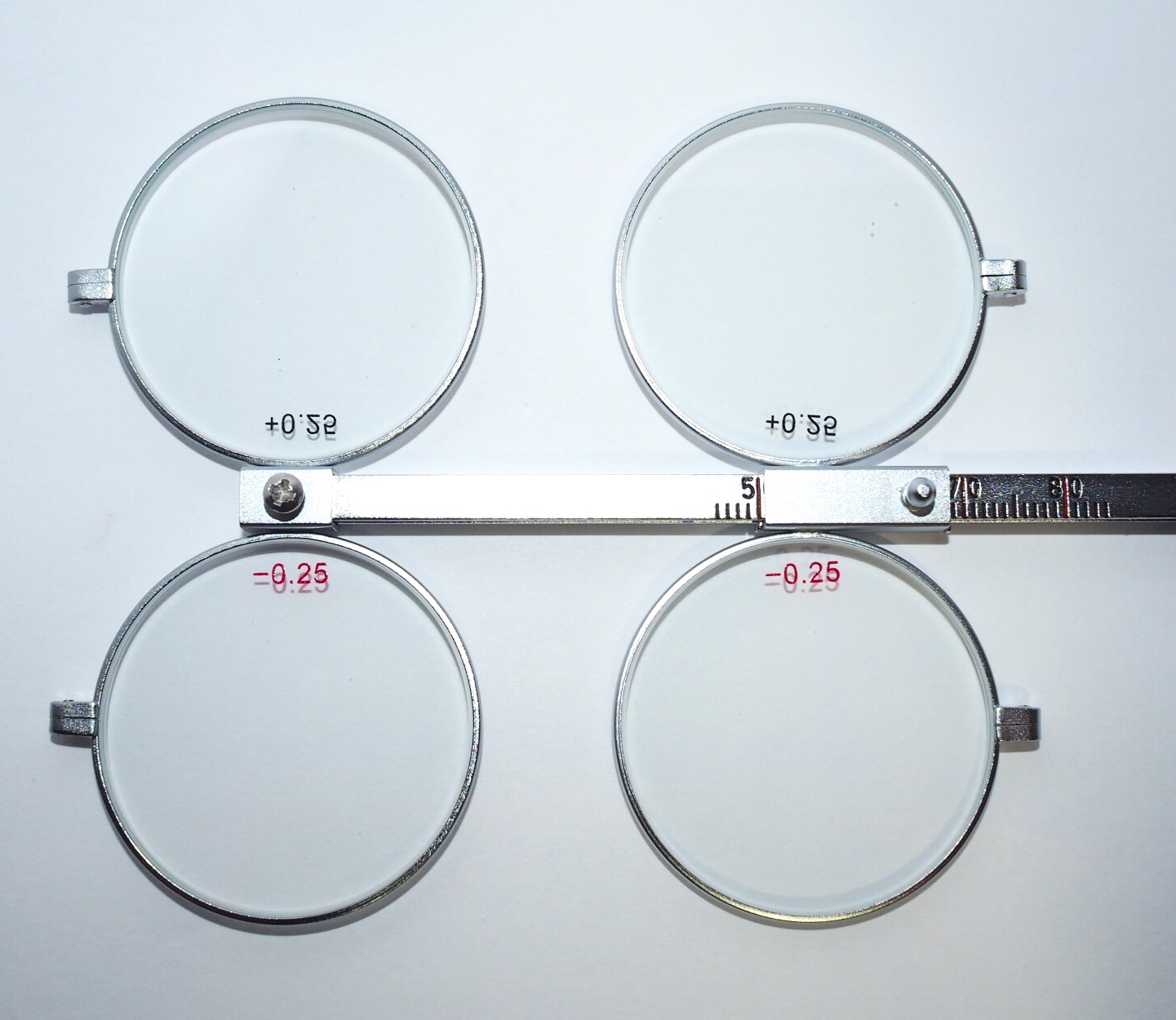 Metal Lens Flippers +/ 0.25D « StrongVisionTech