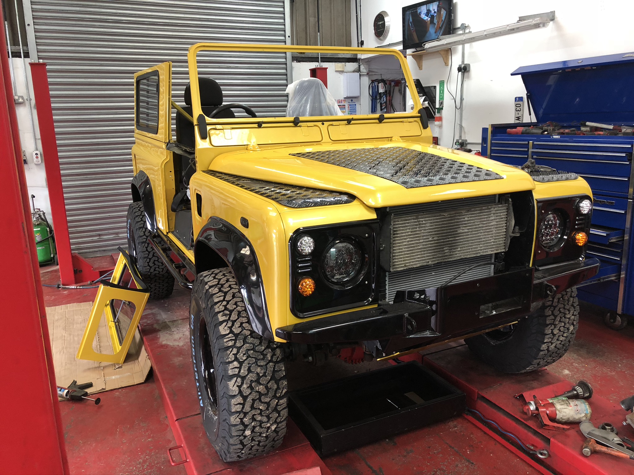 Our Yellow Defender 90 Stryker Landrover