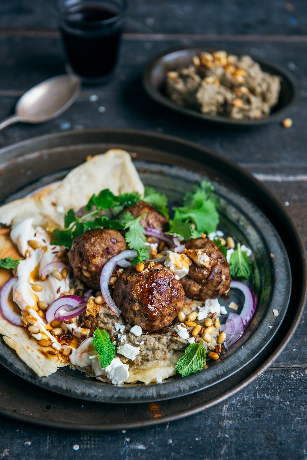 loaded lamb meatballs with eggplant hummus, yoghurt, pine nuts, coriander & mint Stuck in the