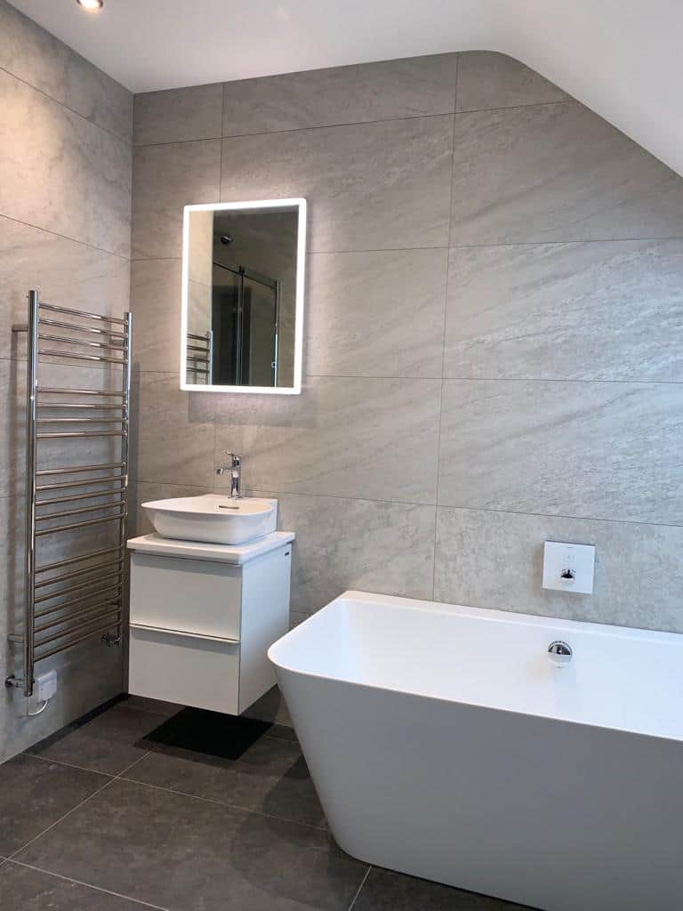 Bathroom and Walk in Shower with Sloped Ceilings Studio One South