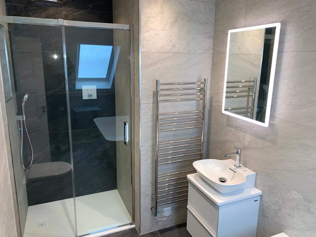 Bathroom and Walk in Shower with Sloped Ceilings Studio One South
