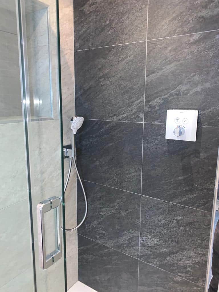 Bathroom and Walk in Shower with Sloped Ceilings Studio One South