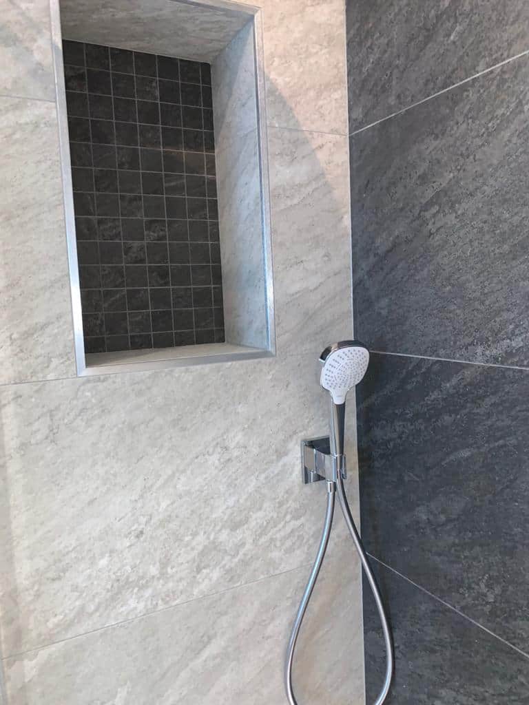 Bathroom and Walk in Shower with Sloped Ceilings Studio One South