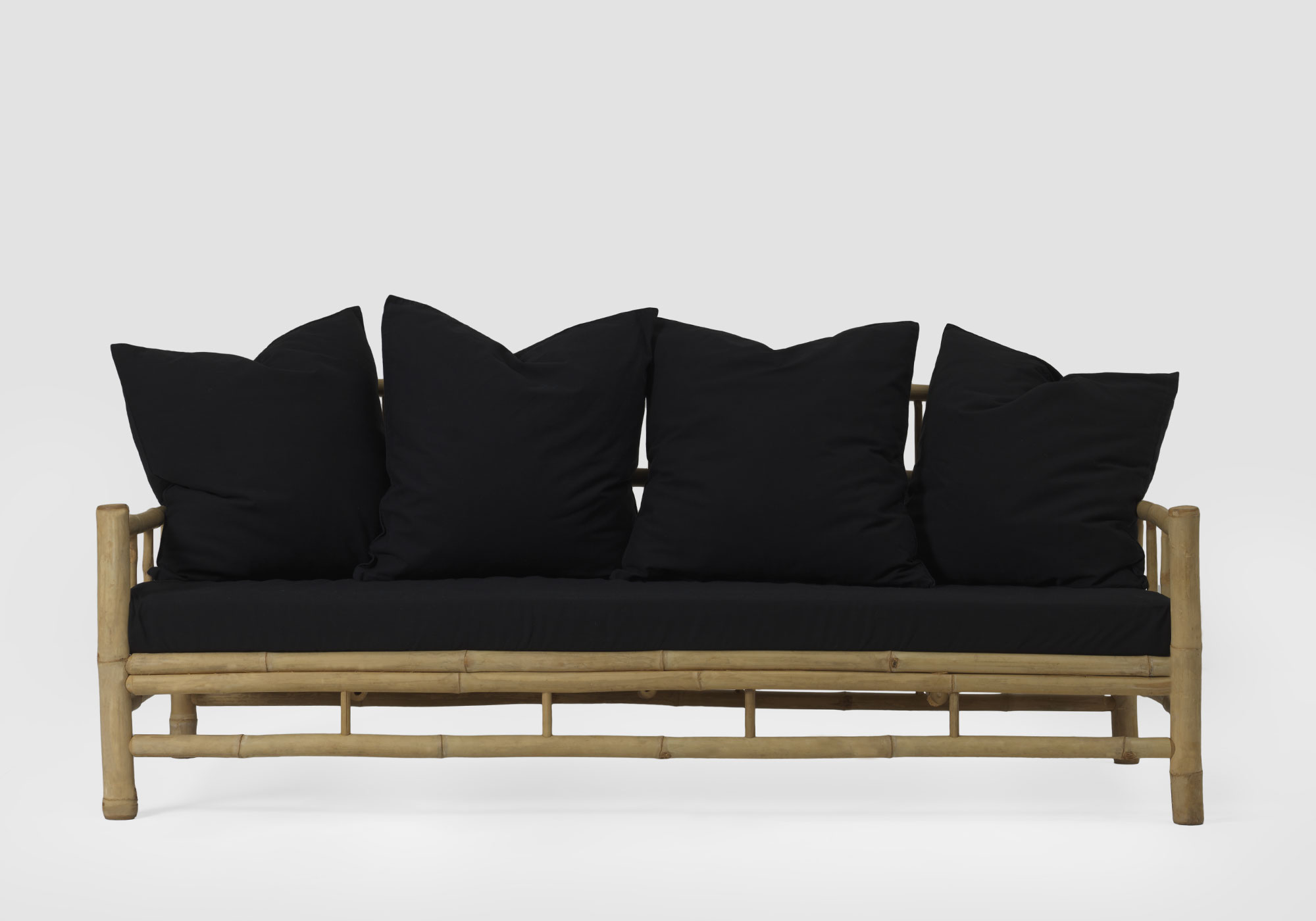 Bamboo Sofa with black pillows