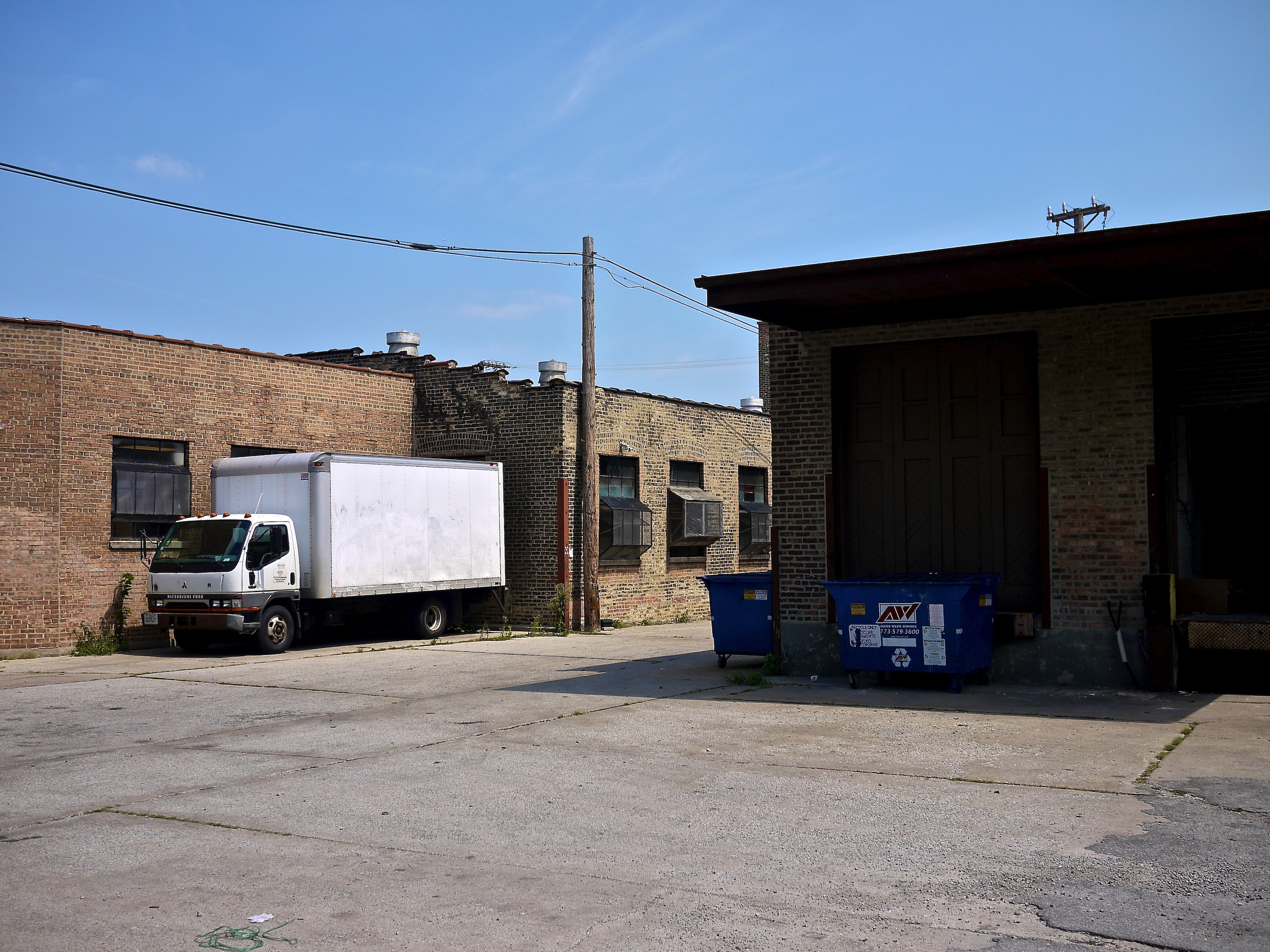 An open industrial loading area with a truck.