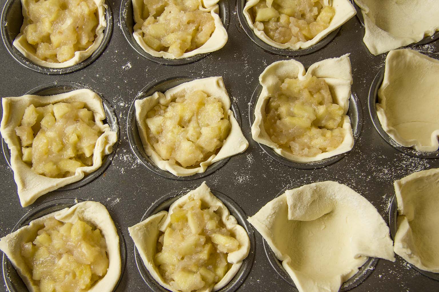 apple tarts in muffin pan with puff pastry