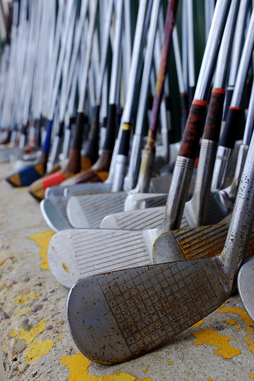 Row of Many Old Used Golf Clubs for Sport SuperClean
