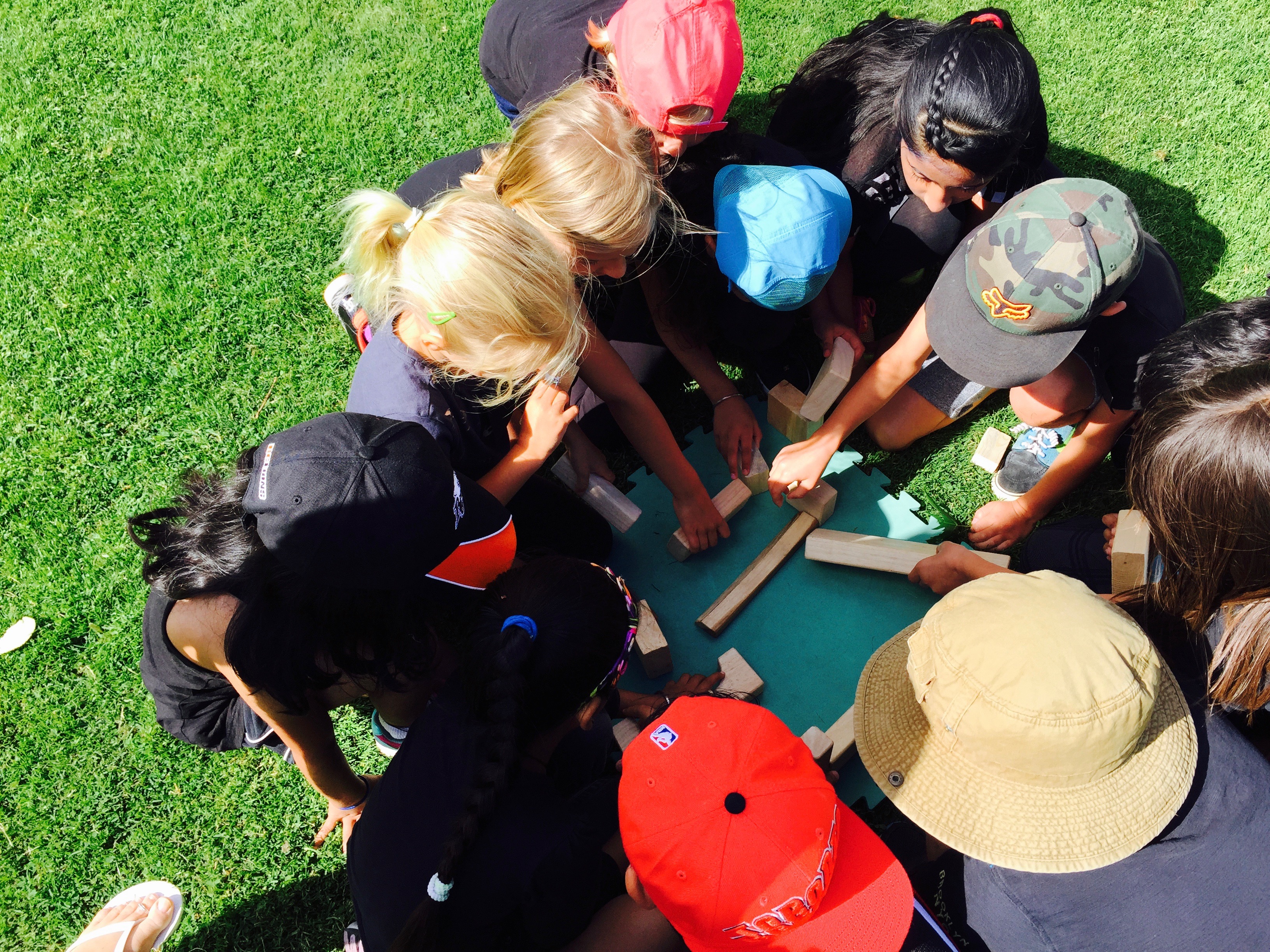 We often play cooperative games during break times. While it looks like students are just having fun (which they are) they are developing important cooperation and critical thinking skills during these challenges. Ask your child what the group was trying to accomplish during this task? What solution did they come up with?