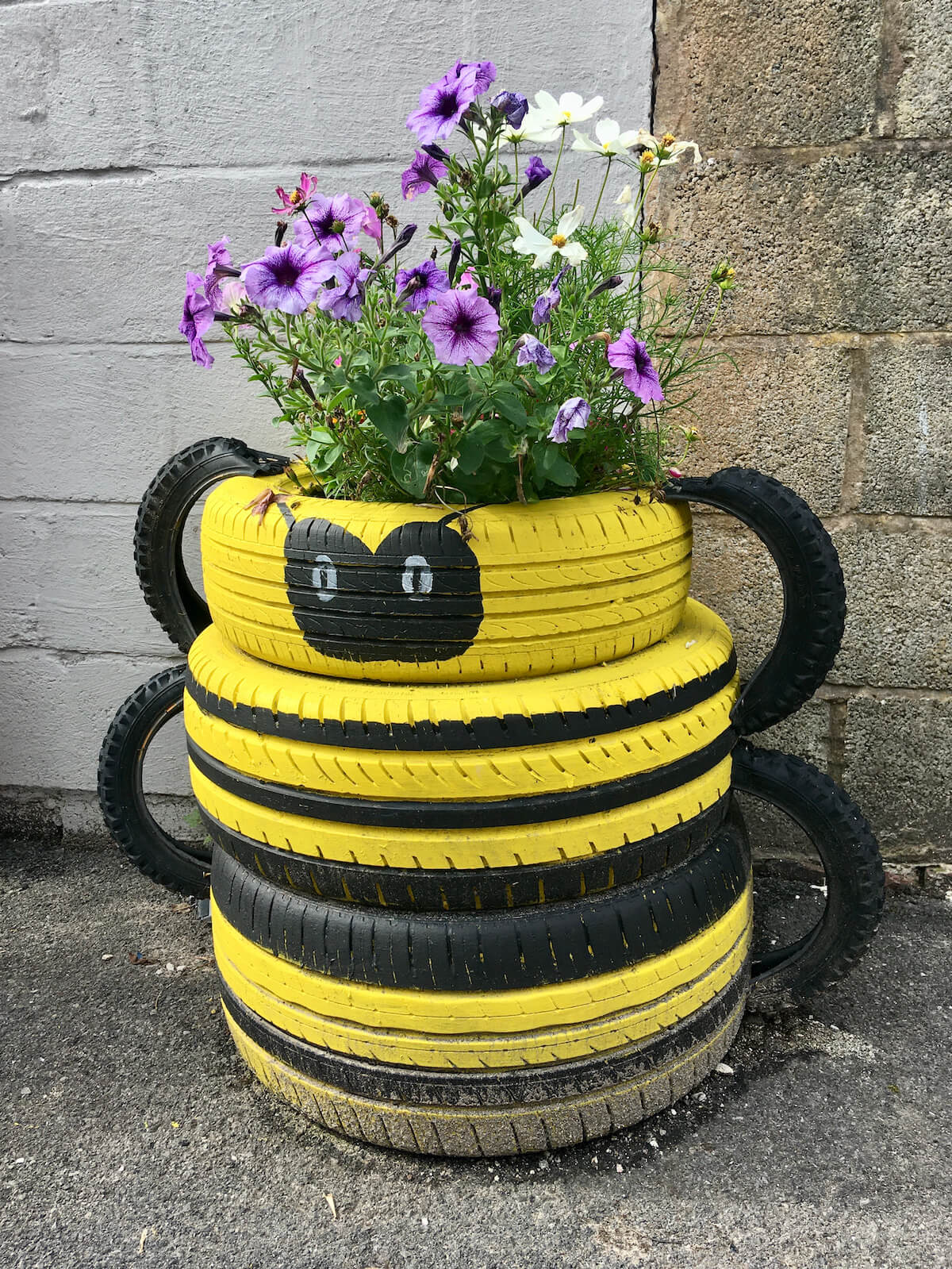 Sweet Tyre Planters Make a Back Alley Look Cared For Susan Rushton