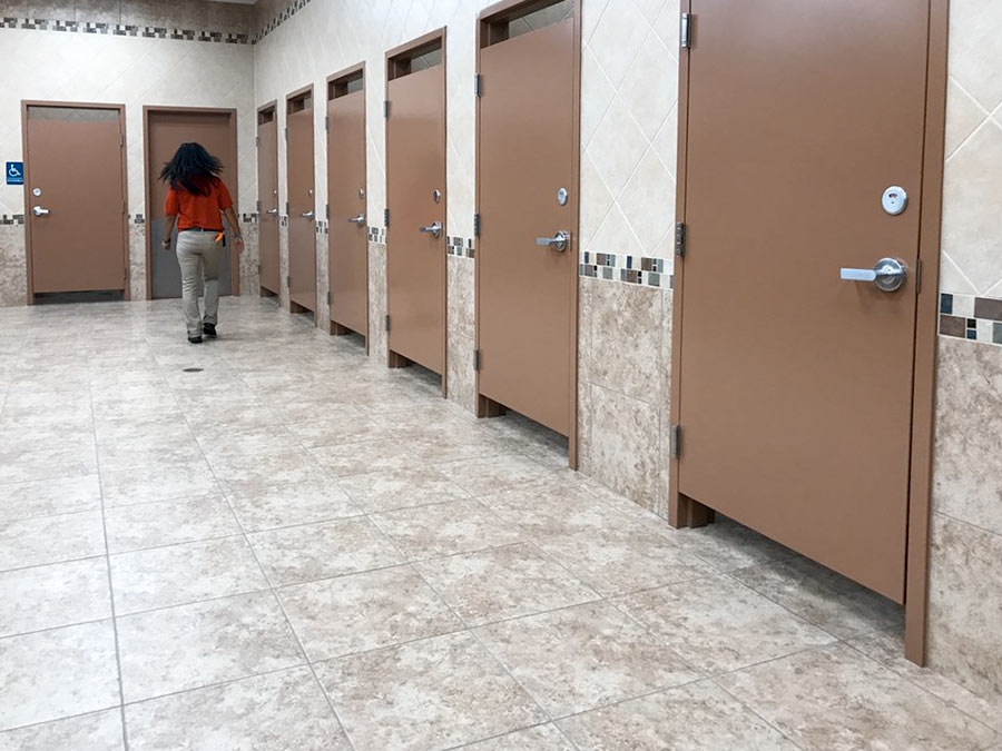 This bathroom has lights above the stalls to indicate whether they’re