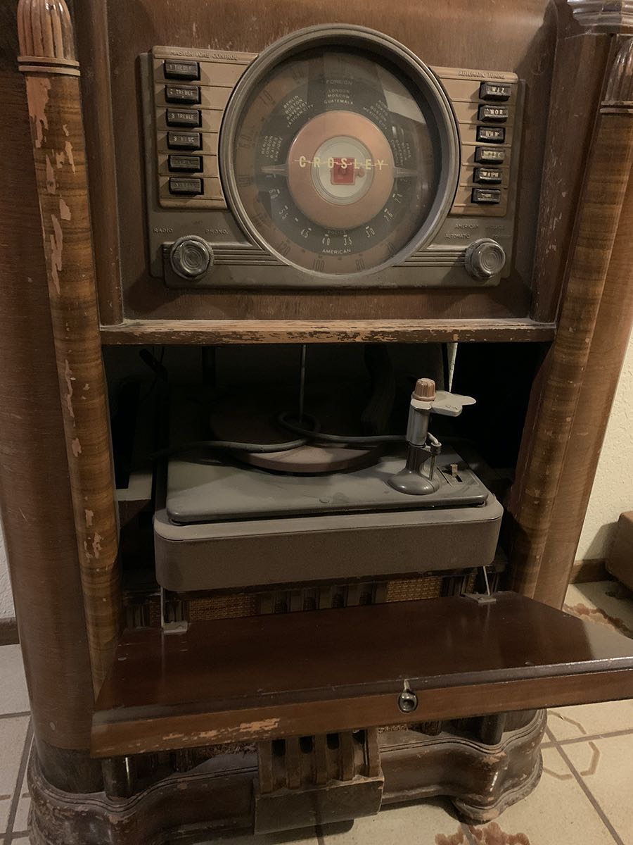Marwan admires his cousin’s Crosley receiver/phonograph console The