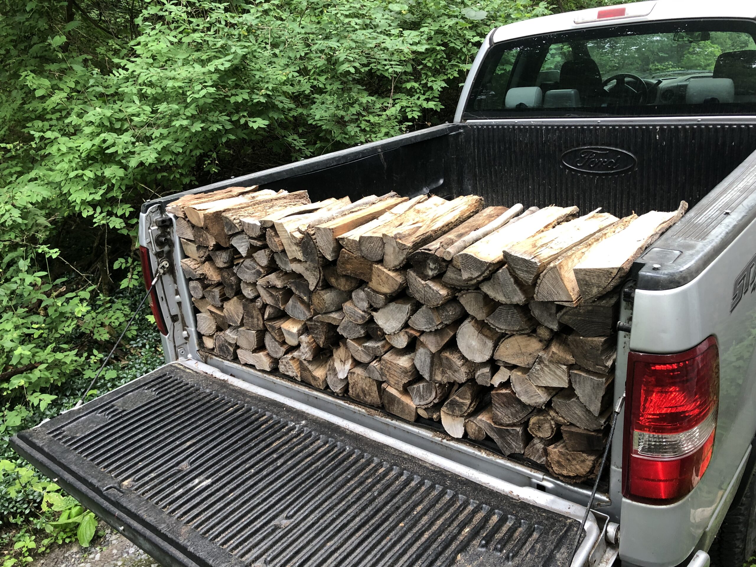 Single Row of seasoned hardwood firewood on truckbed delivered