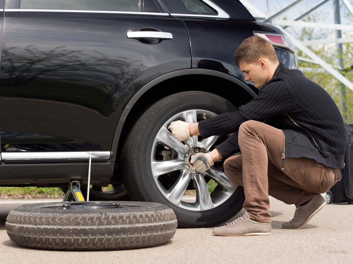 The CarHub Guide to Changing a Car Tire CarHub Automotive Group