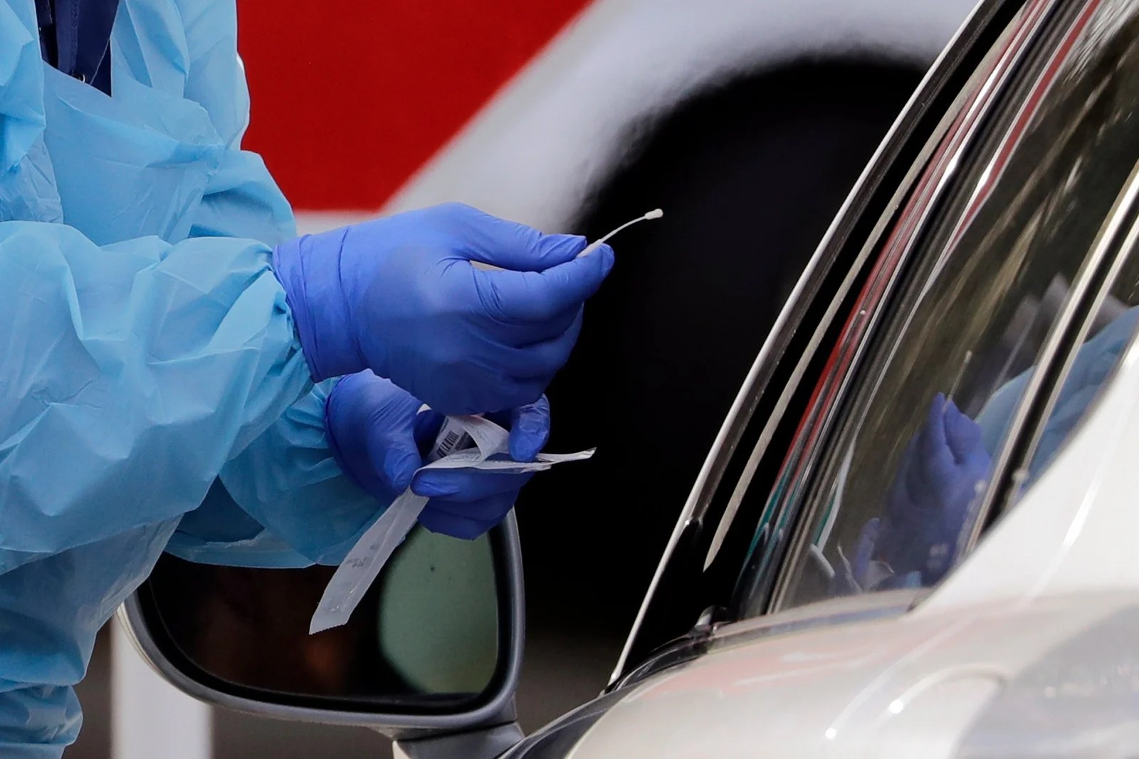 A woman takes a swab test for the virus. Credit: ITV News Central