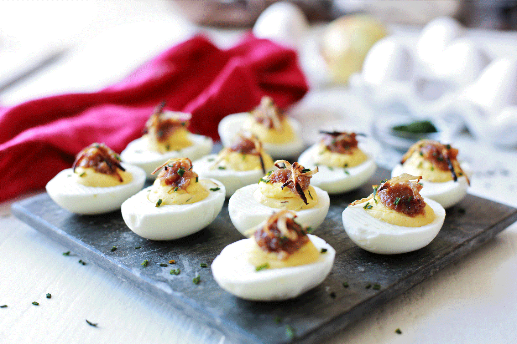 Deviled Eggs topped with Bacon Marmalade and Crispy Onions Tangled
