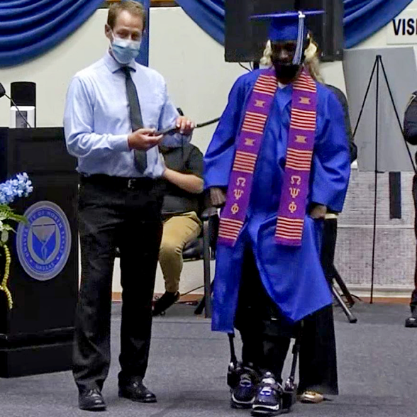 Paralyzed Former Football Player Walks Across Graduation Stage After 12