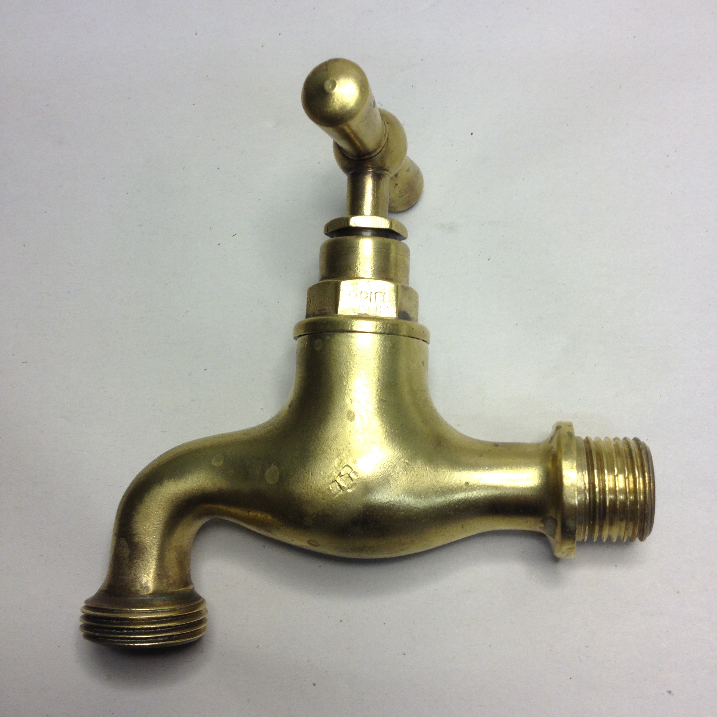 A “Burnished Brass” garden tap