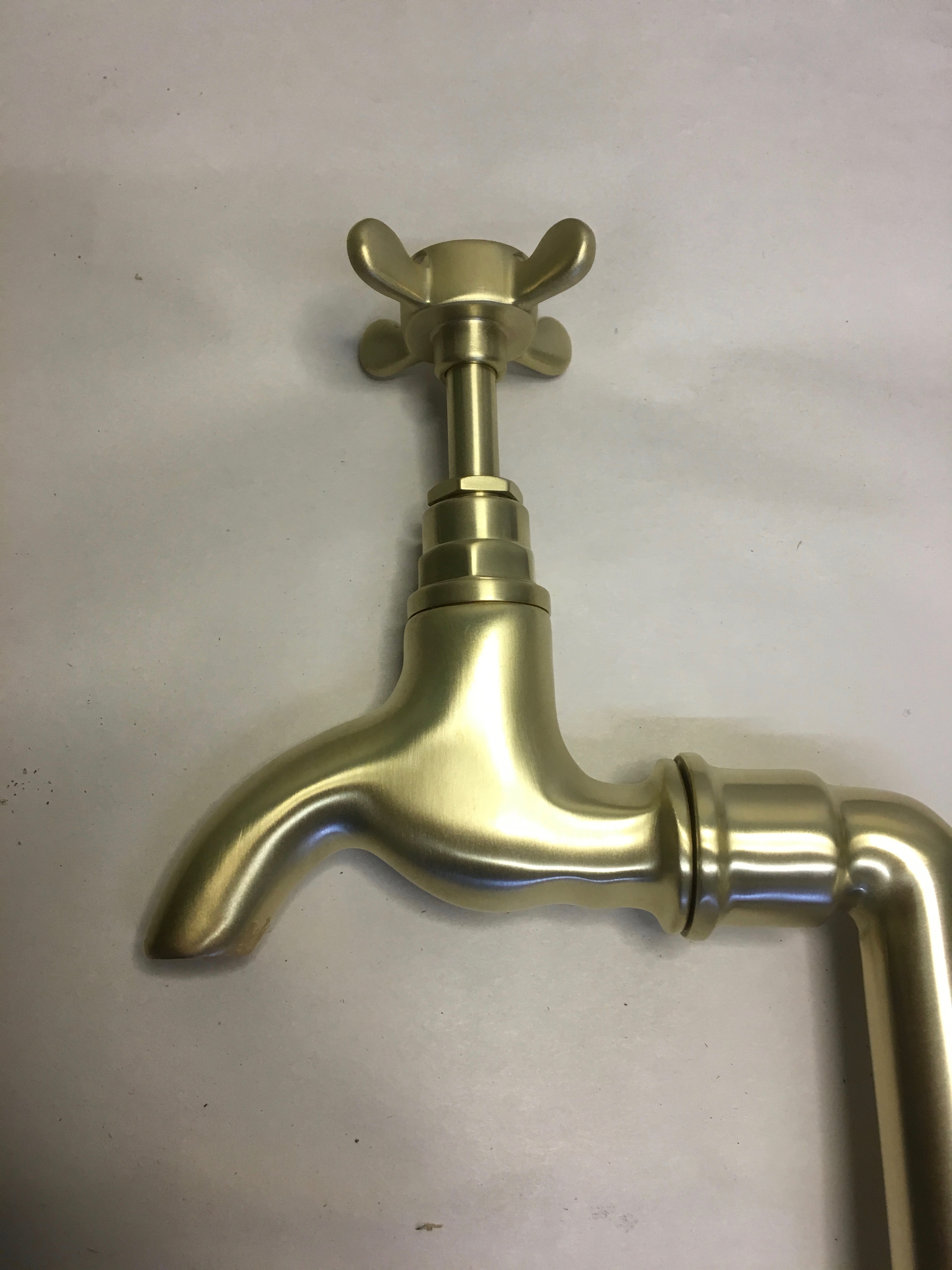 Bib taps on stands in “Brushed brass”.