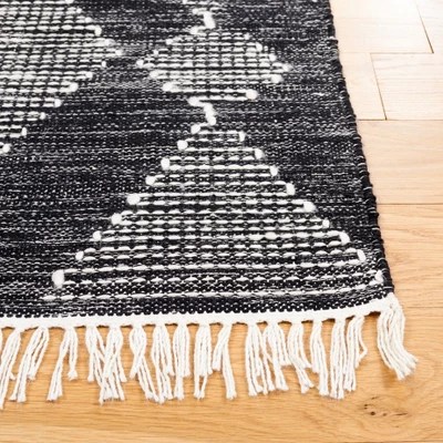 Bohemian Nomad Black & Ivory 4' x 6' Synthetic Area Rug • Spoken