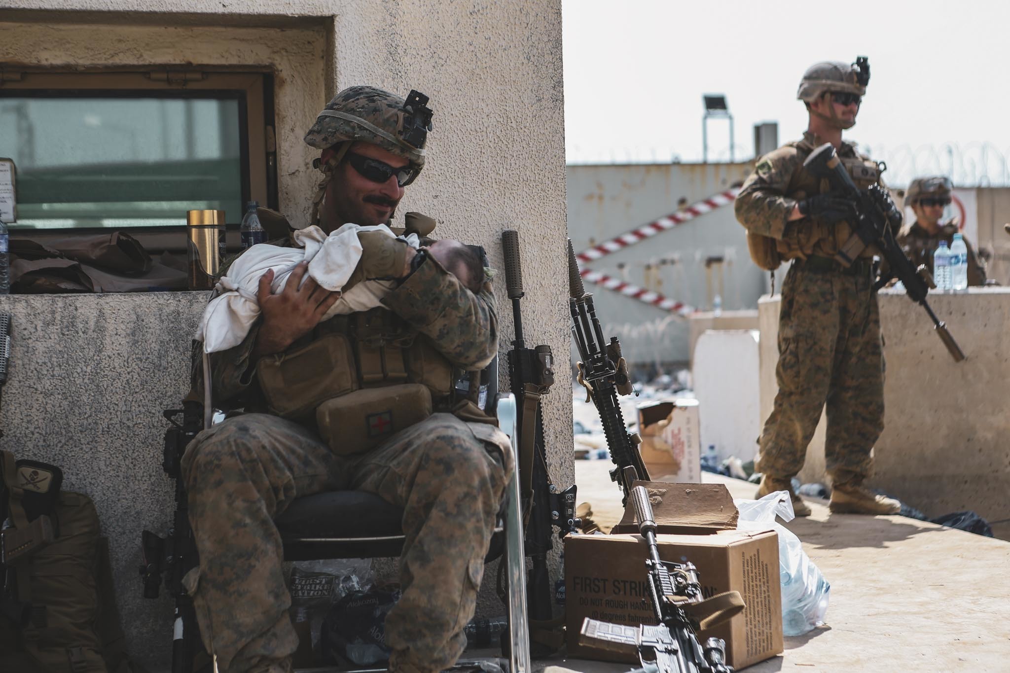 US Marine rescues baby over wall of Kabul airport in Afghanistan