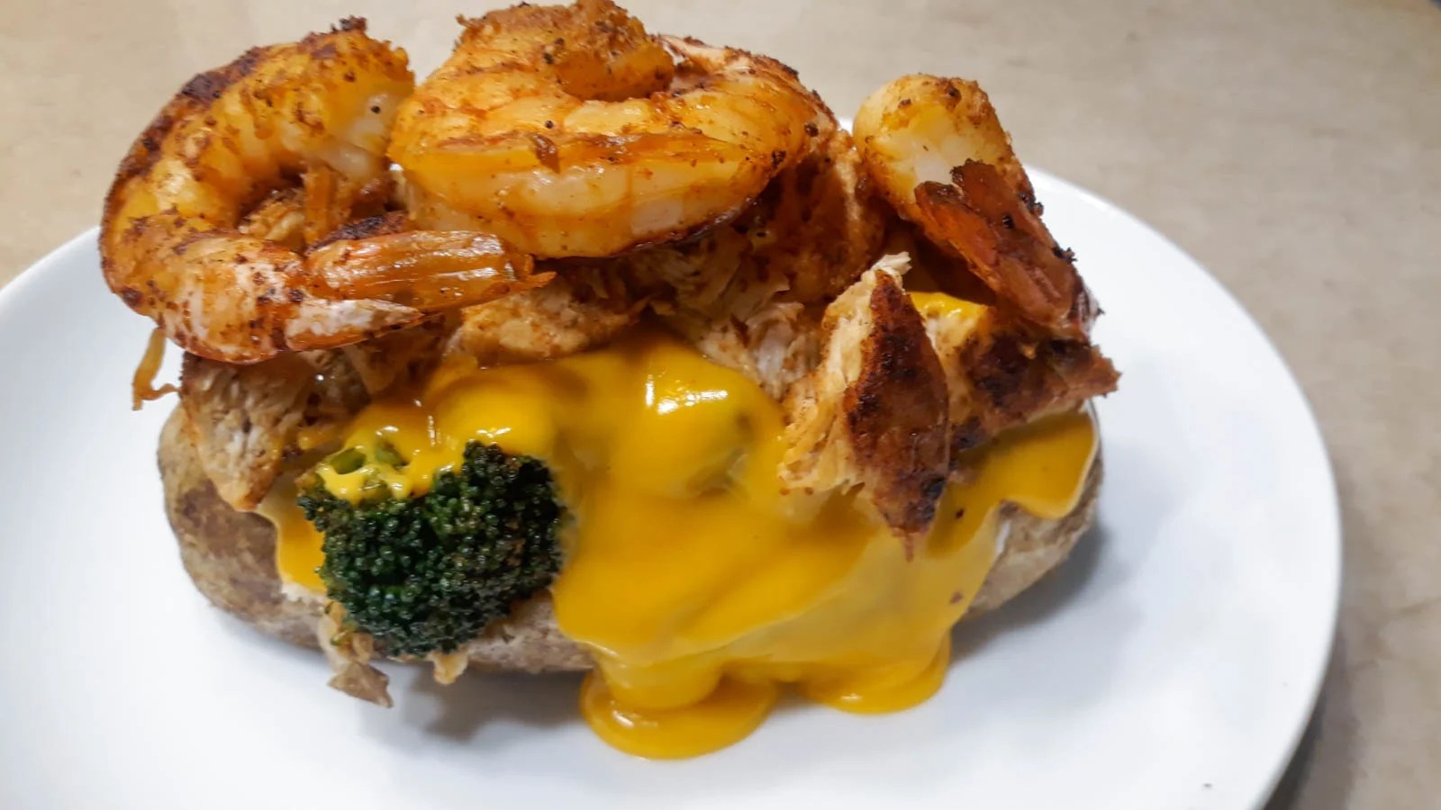 Loaded baked potato Cajun shrimp vs Philly cheese steak TasteDis