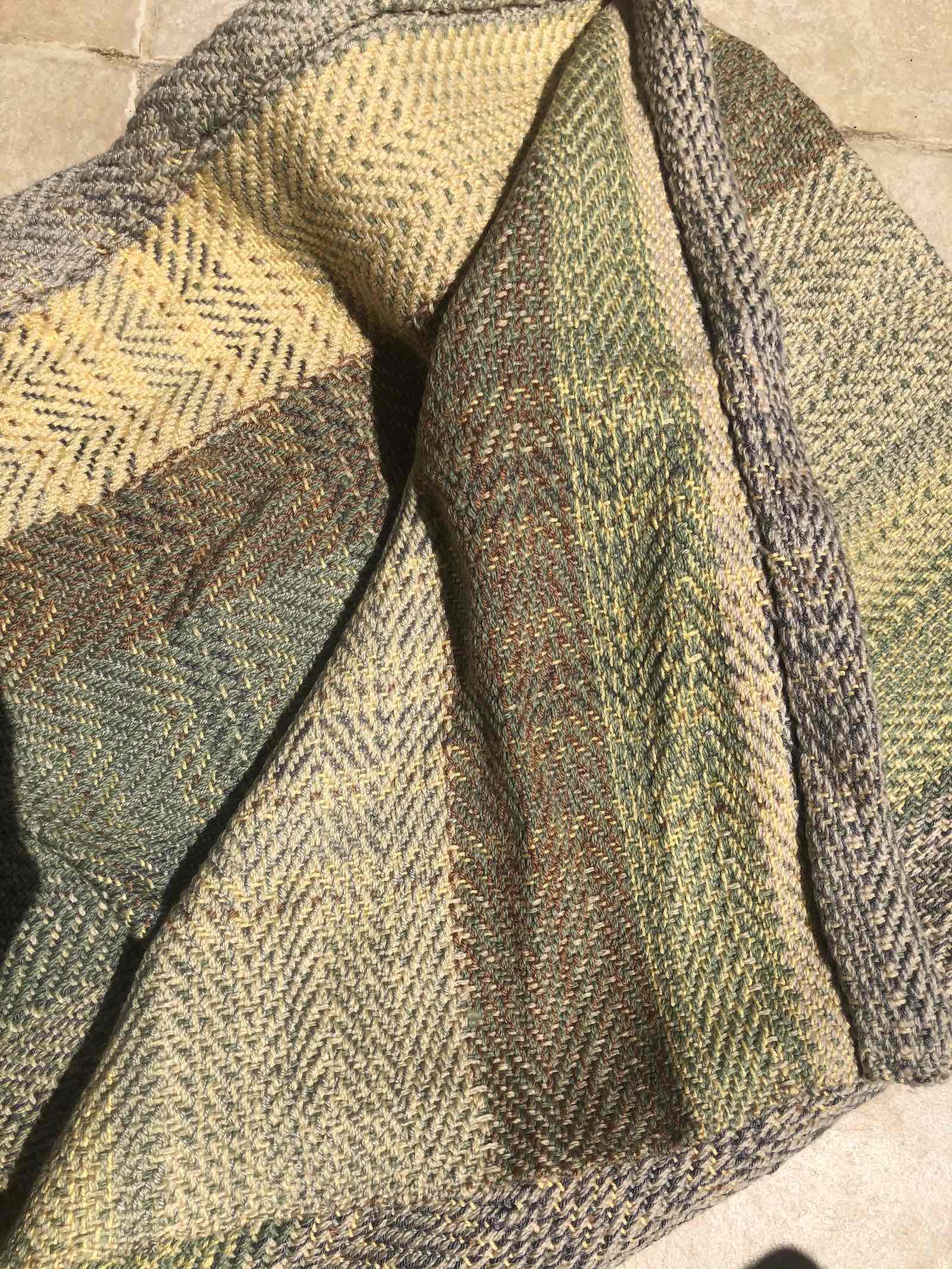 Handwoven wool blanket by TASUE