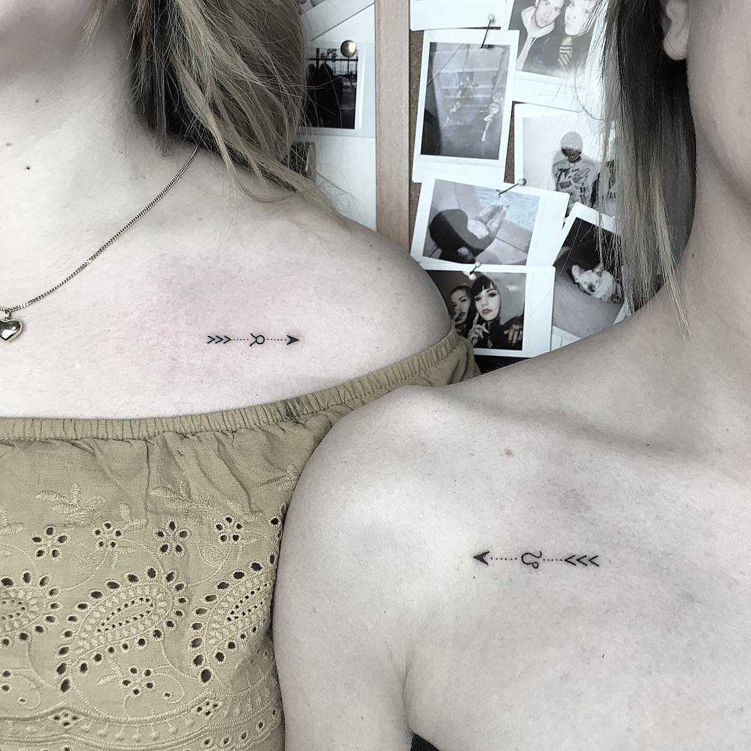 Matching arrow tattoos for sisters