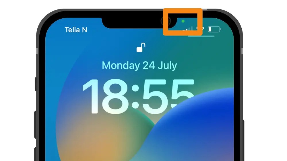 Why does the Green Dot appear when unlocking on iPhone 2023