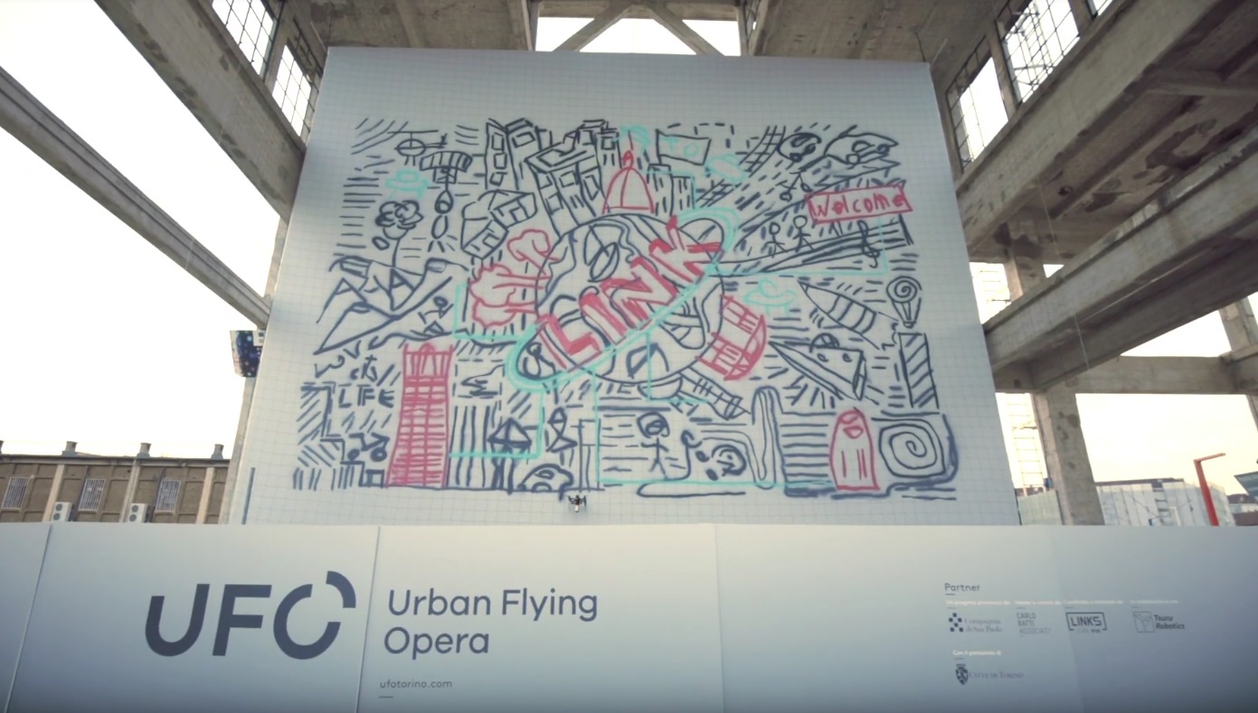 This drone swarm spray painted a jumbosize graffiti mural TechCrunch