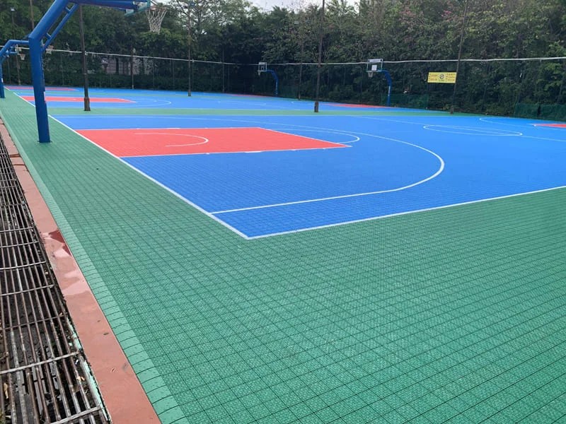 What kind of floor material is usually used for a basketball court