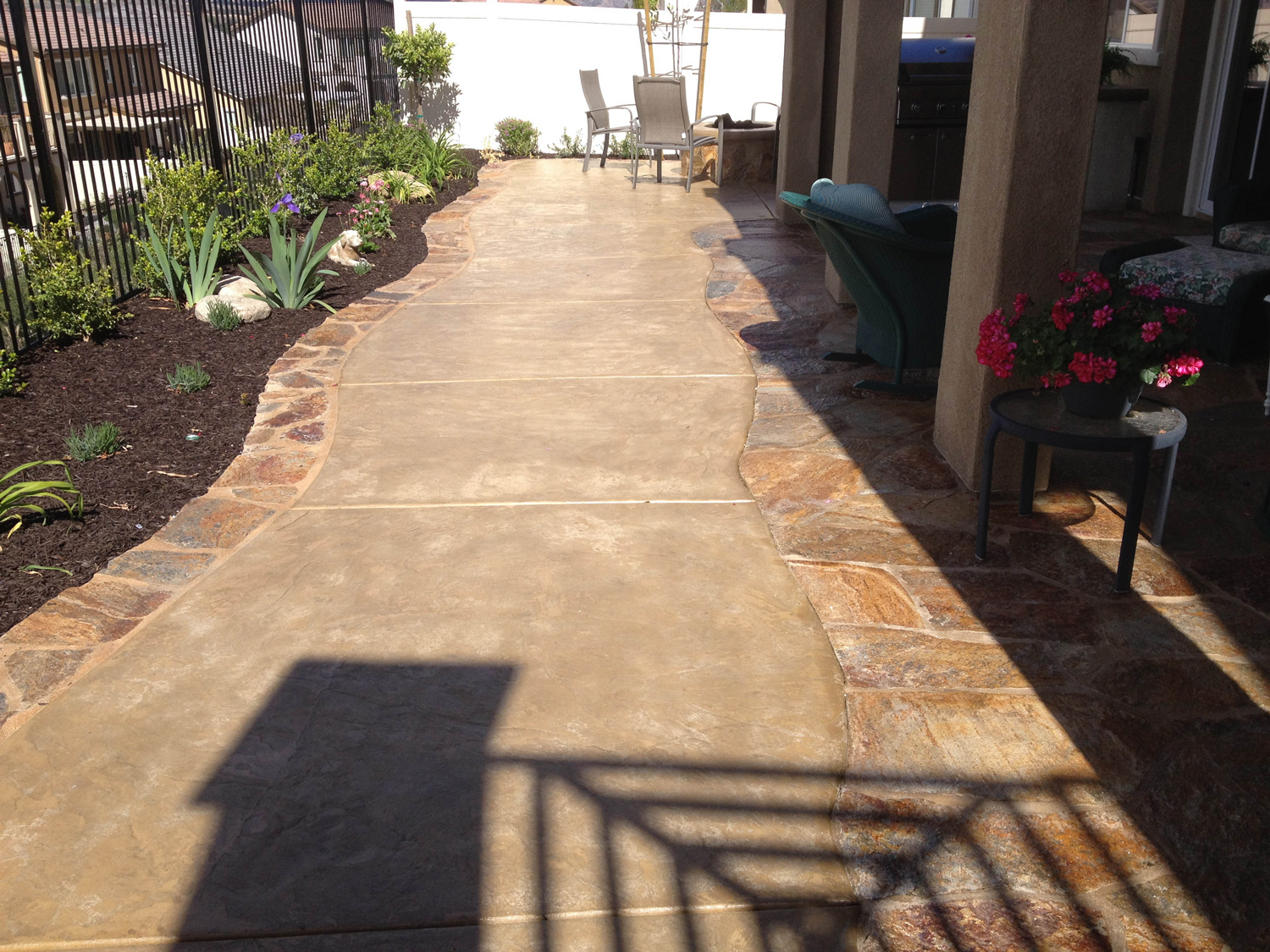 Concrete and flagstone patio extension McCabe's Landscape Construction