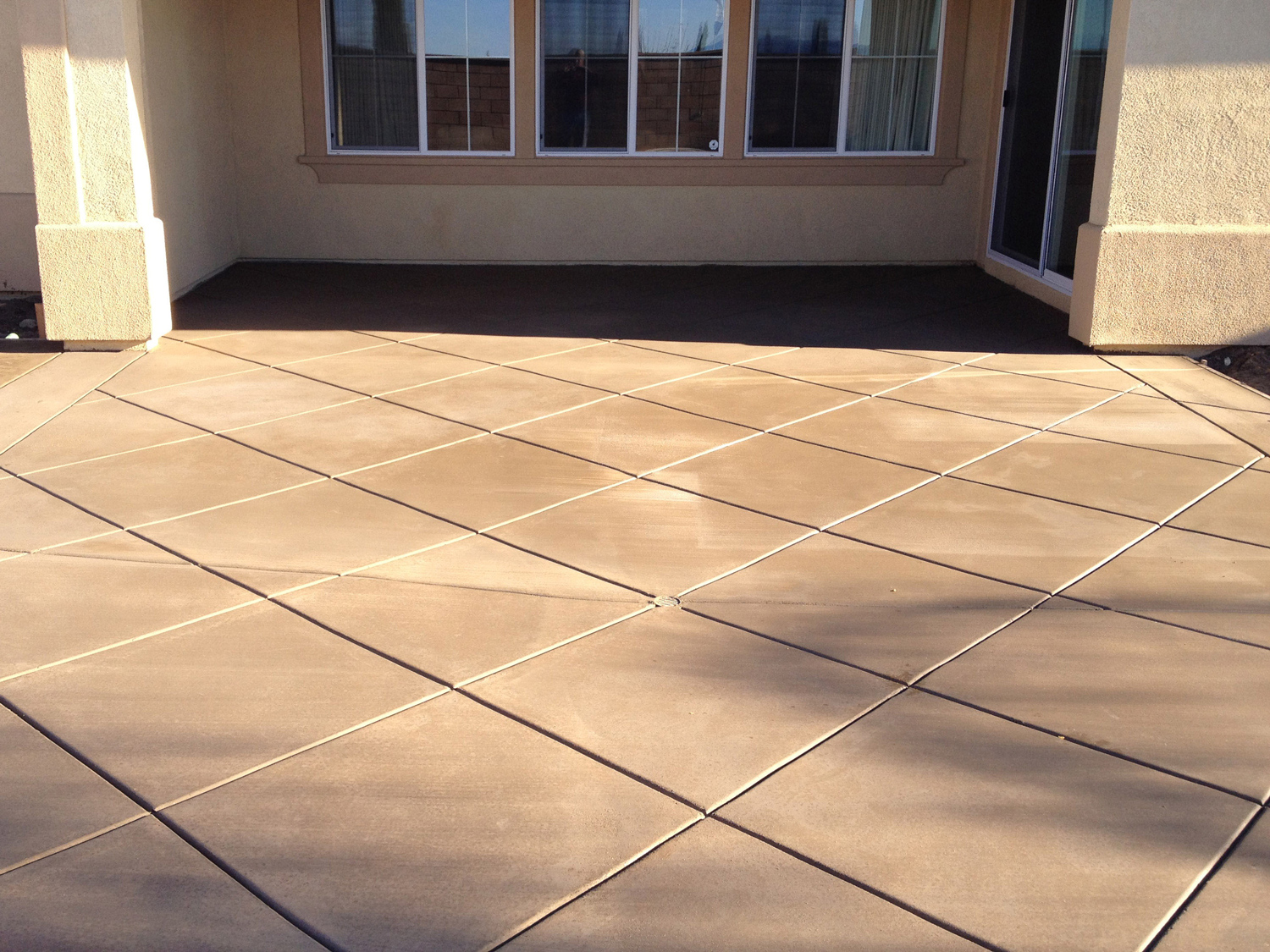 Diamond patterned colored concrete McCabe's Landscape Construction