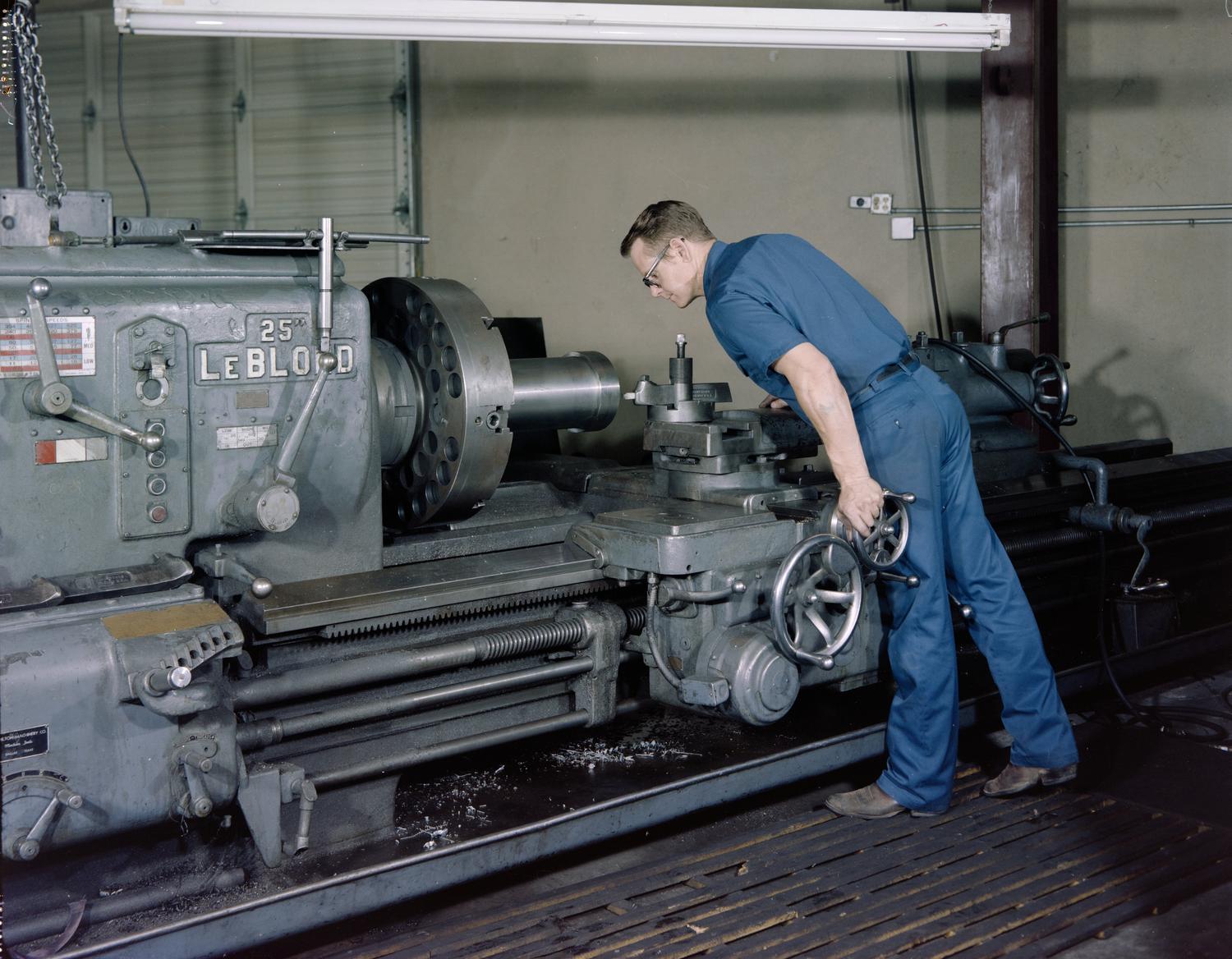 [Man using a LeBlond engine lathe at Oil States Rubber Co.] The