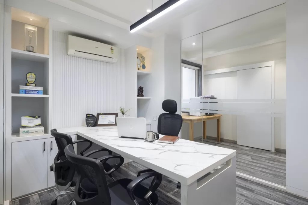 An Uncluttered and Naturallylit Office Space With Monochromatic