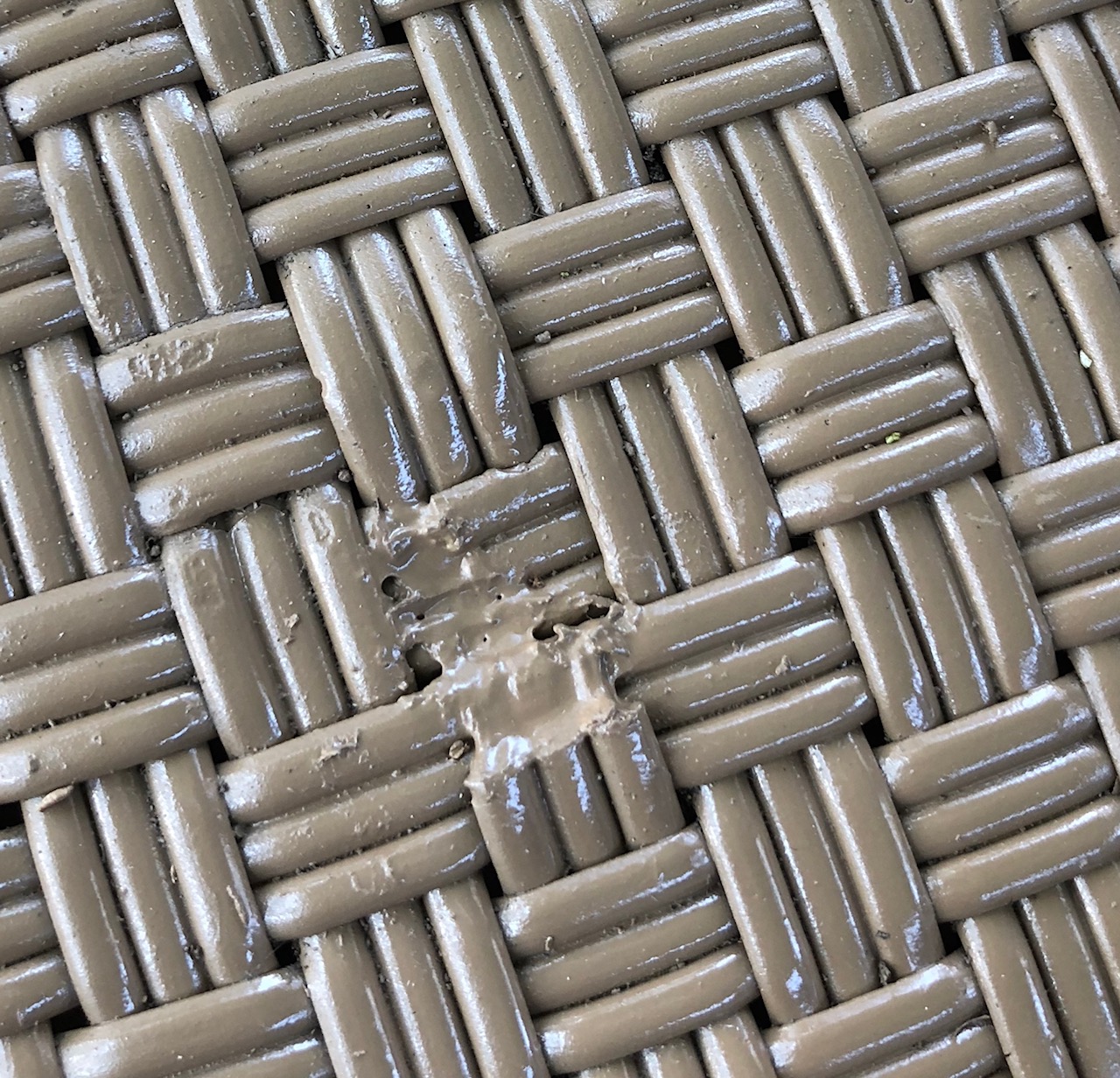 Repairs made before spray painting plastic furniture.