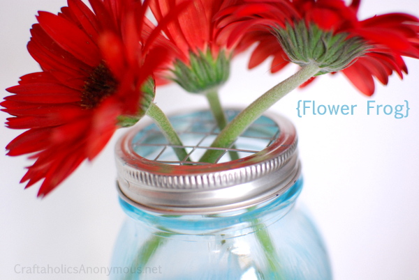 This mason jar as a vase for flowers is unexpected and looks so cute.