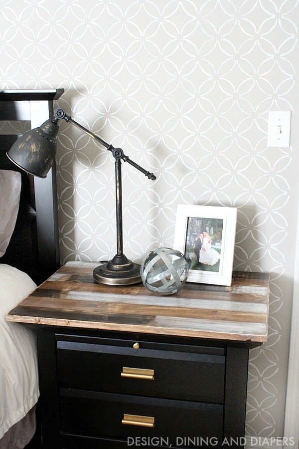 A rustic, weathered stain and black paint gives this IKEA side table a slick yet rustic farmhouse style