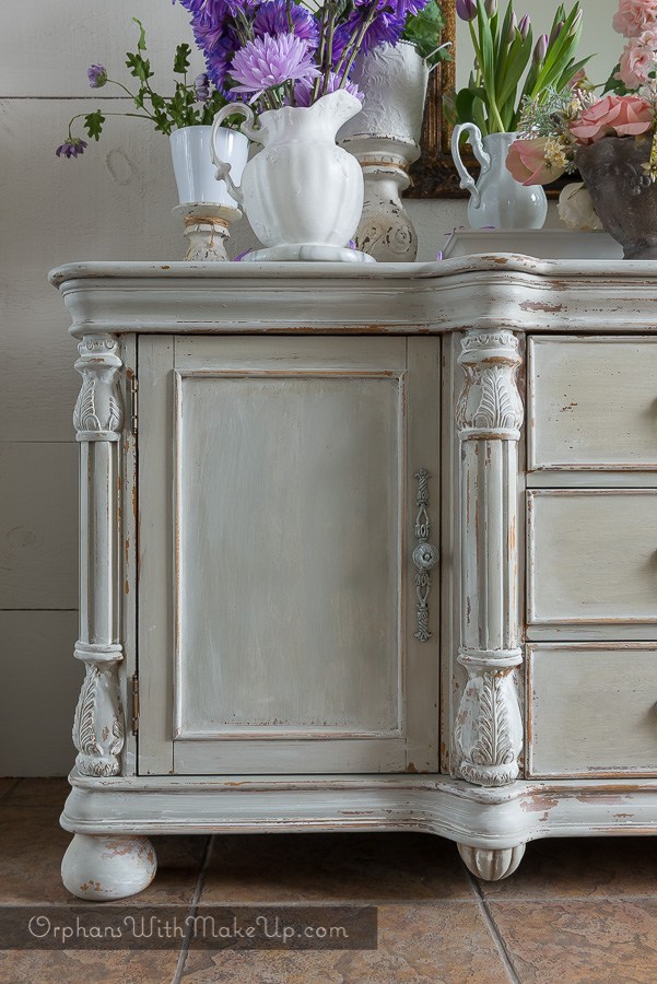 This refurbished dresser looks amazing with a whitewashed distressed paint for a classic vintage look