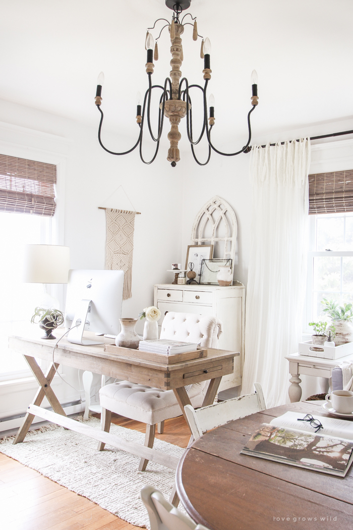This farmhouse workhorse style desk is a lovely workspace in a stylish living room