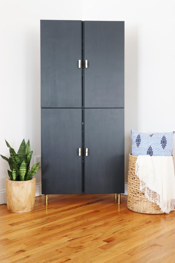 This IKEA library cabinet was painted black and with some added gold hardware is a gorgeous sleek farmhouse armoire