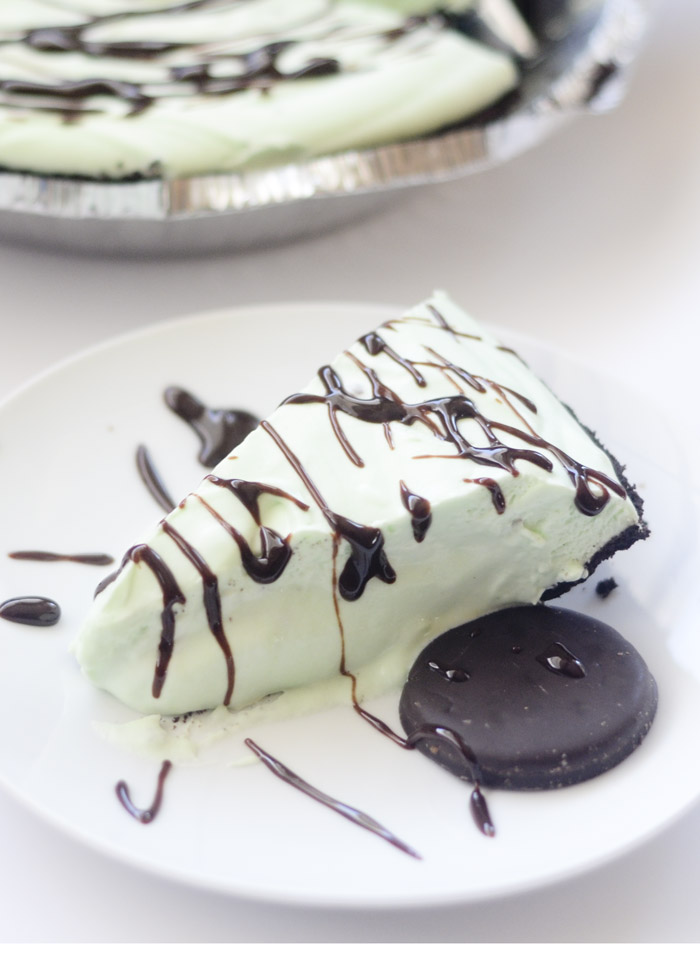 This frozen grasshopper pie topped with chocolate and a cookie is divine.