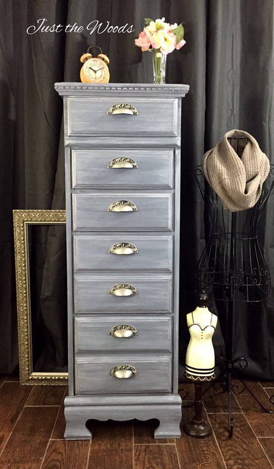 This renovated dresser painted blue with antique handles is beautiful.