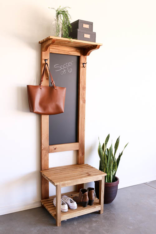 This chalkboard area in the entryway doubles as storage too.